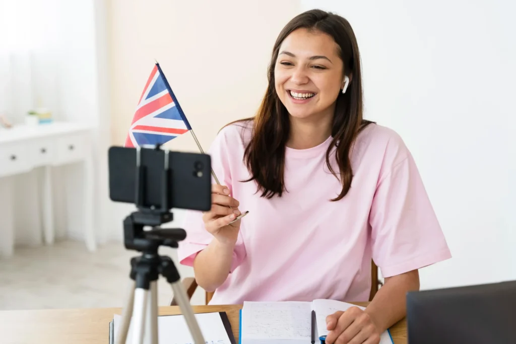Femme faisant un vlog avec un drapeau de l'angleterre